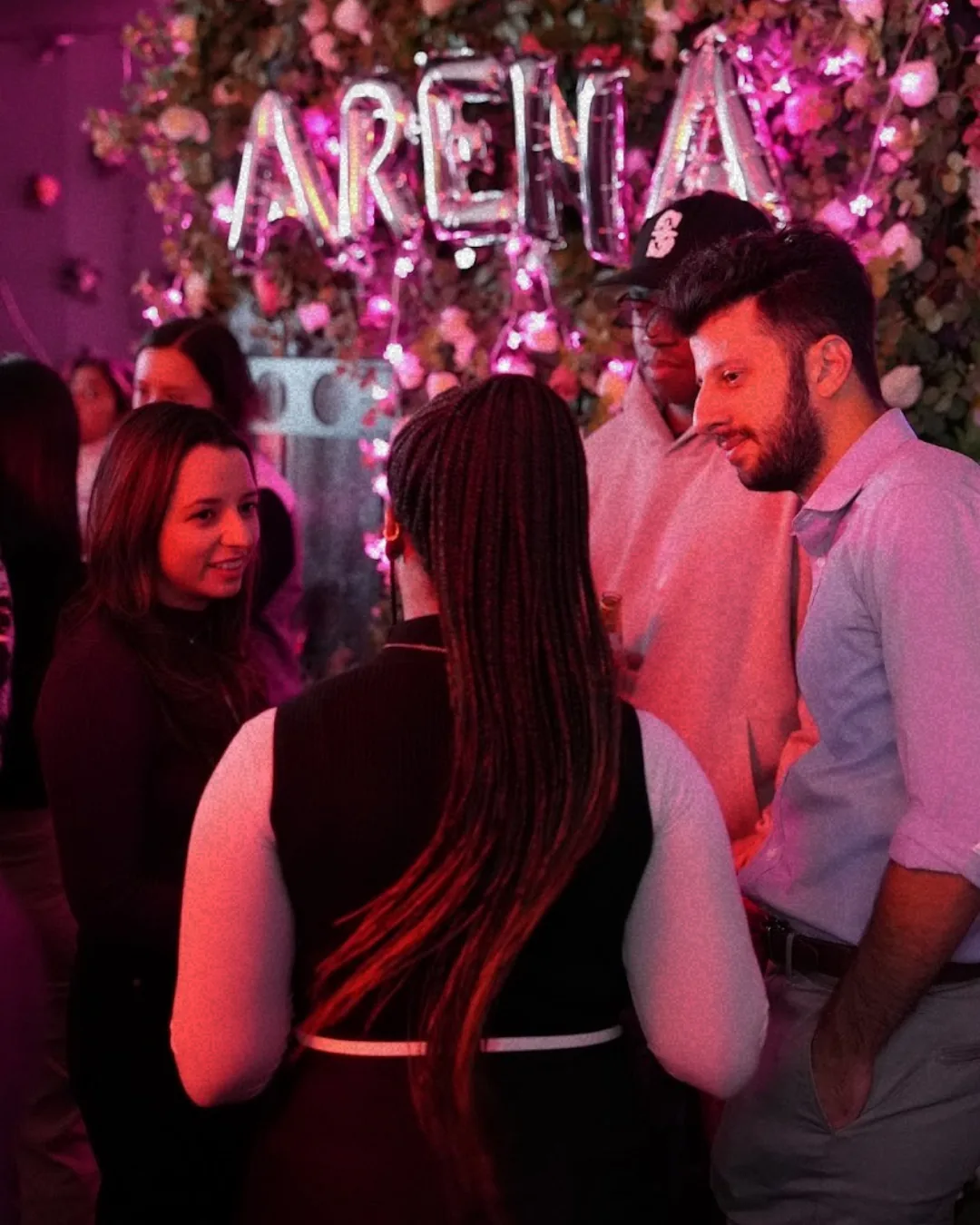 Arena members in conversation at a community event
